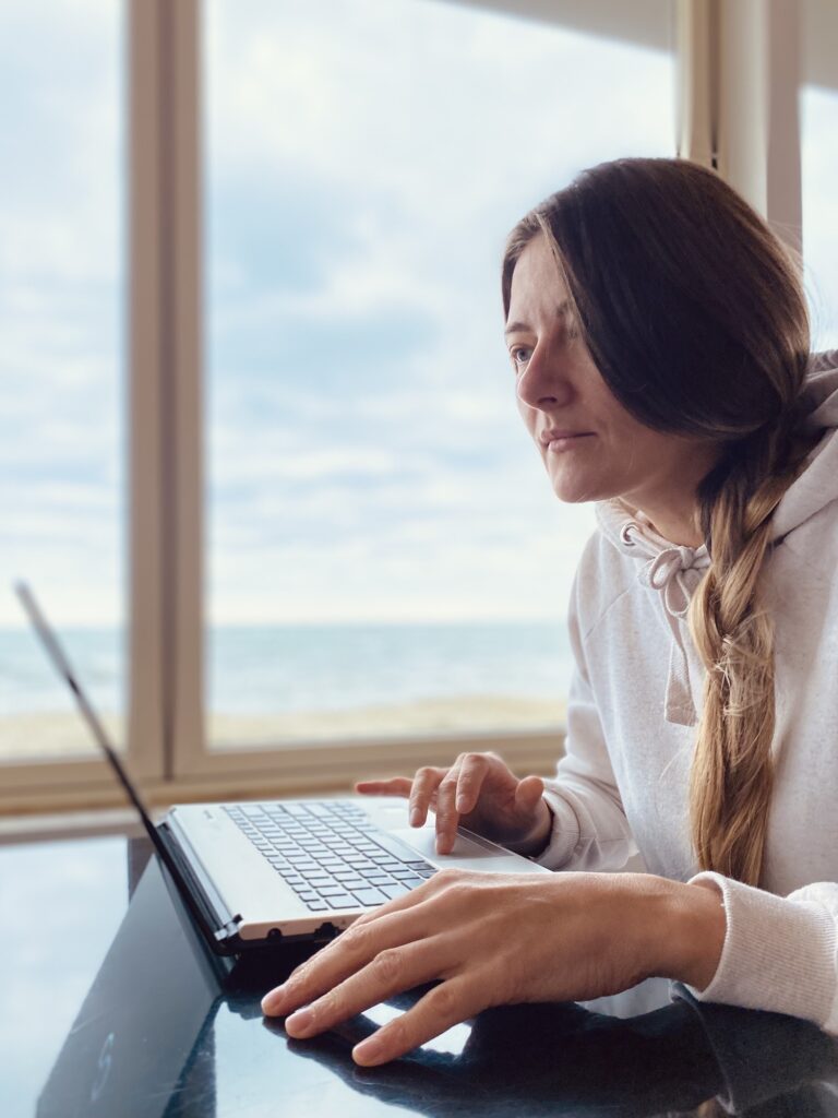 Middle aged woman using laptop